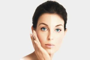 Skin whitening woman hand on face
